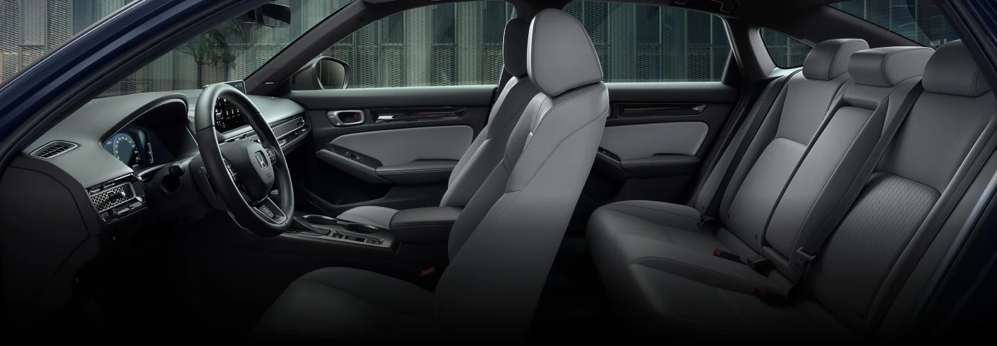 Side view of the Civic interior showing the front and rear seats.