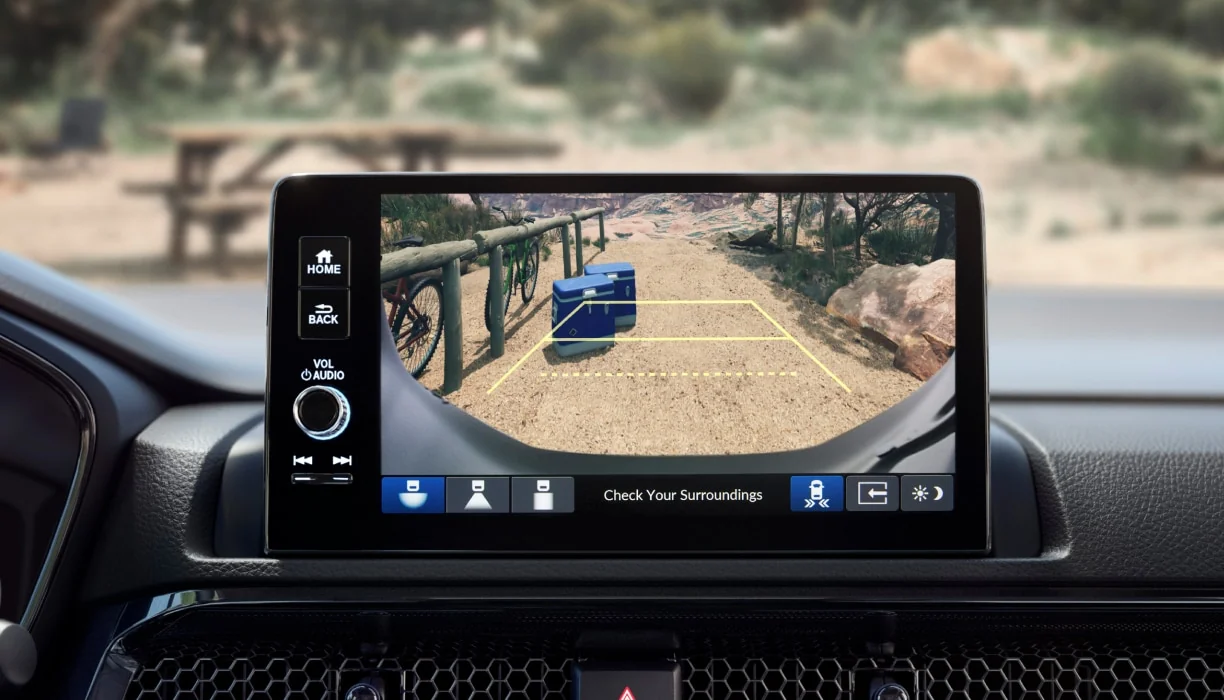 The CR-V touchscreen displaying the rearview camera with parking guidelines.